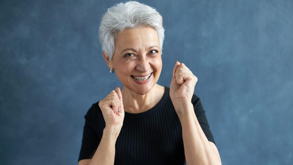 Image contains a smiling lady