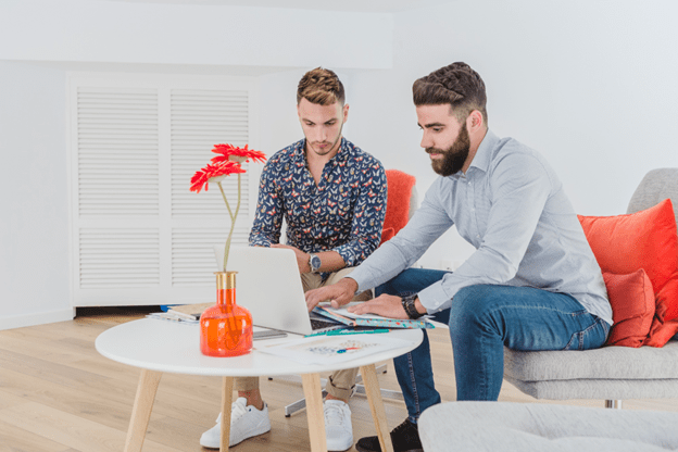 2 Men using laptop
