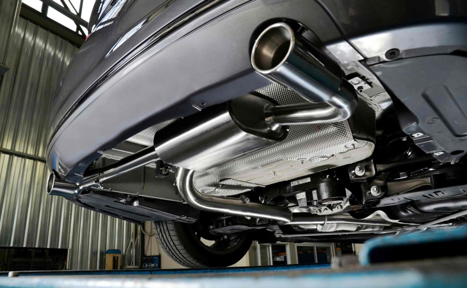 Image contains a closeup view of car exhaust