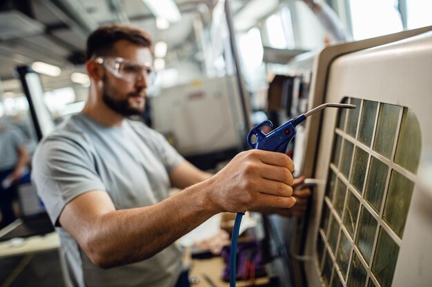 A HVAC technician is fixing air duct leakage