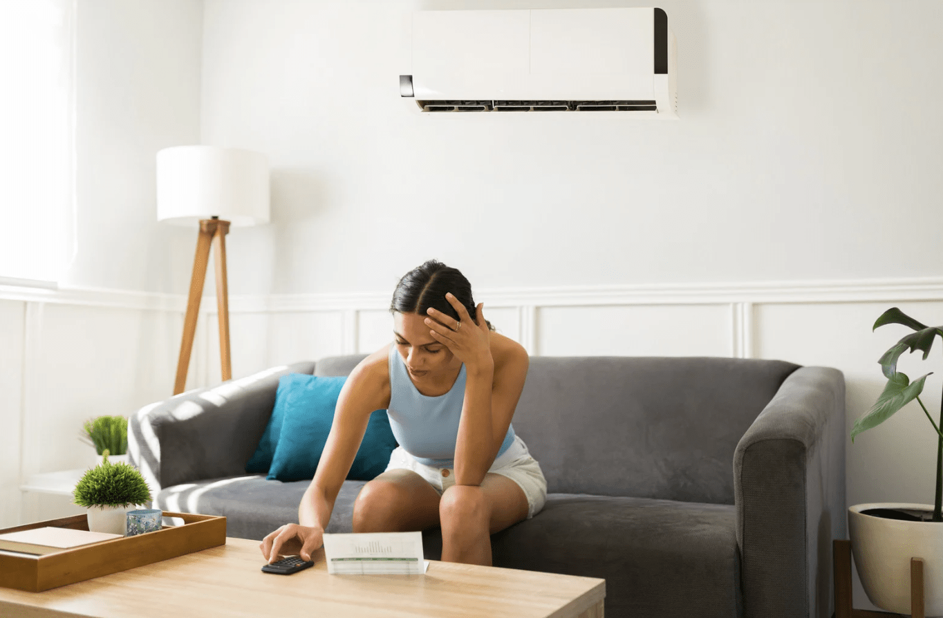 A women is watching at AC repairing quotation paper