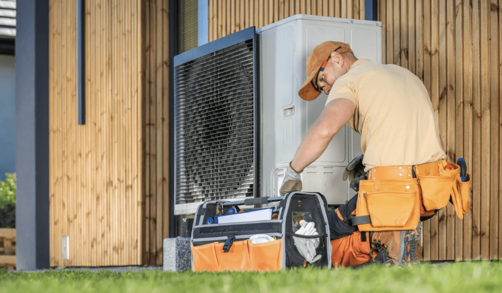 A contractor is repairing HVAC system of a house
