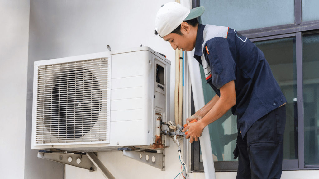 AC technician fixing AC outer