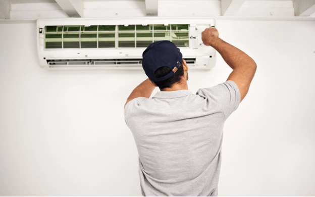 A technician is fixing inner of an air conditioner