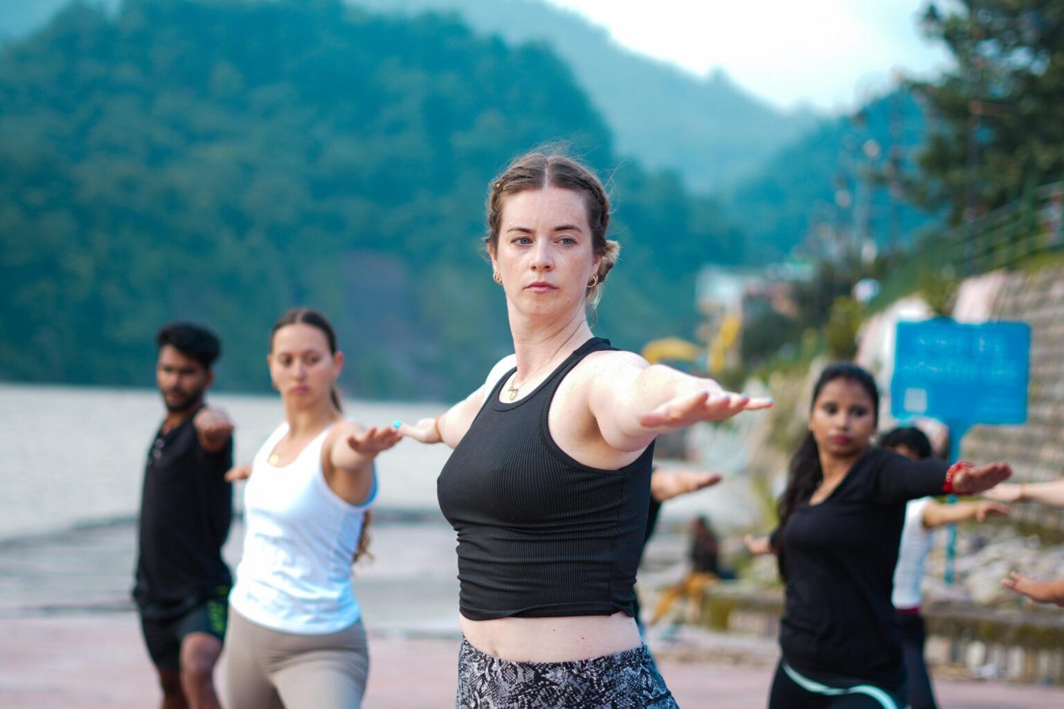 A Yoga teacher is teaching Yoga to ladies