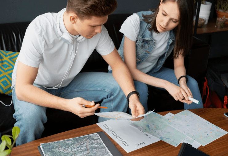 A girl and a boy is observing some papers