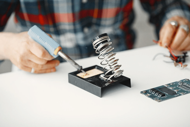 Two Critical Clopay Components: Panel Damage vs. Torsion Spring Failure 